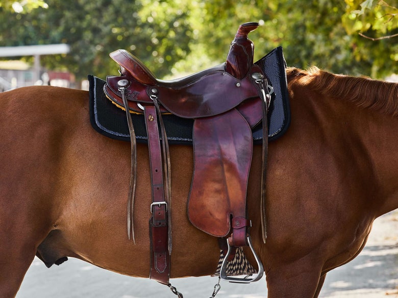 Western saddle pad with a non-slip waffle weave construction.