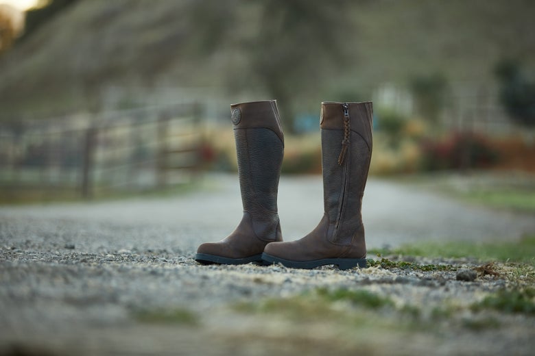 The Moretta Pamina Country Tall Boots in a barn.