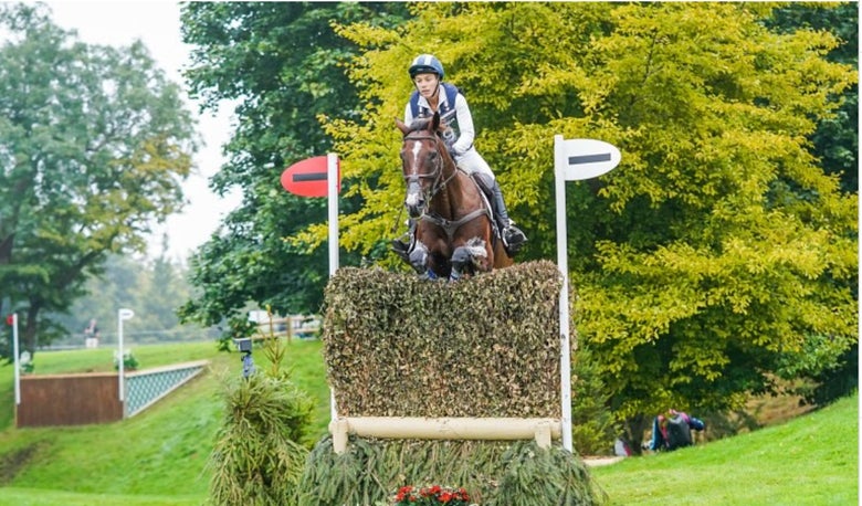 Mia Farley riding a cross country course.