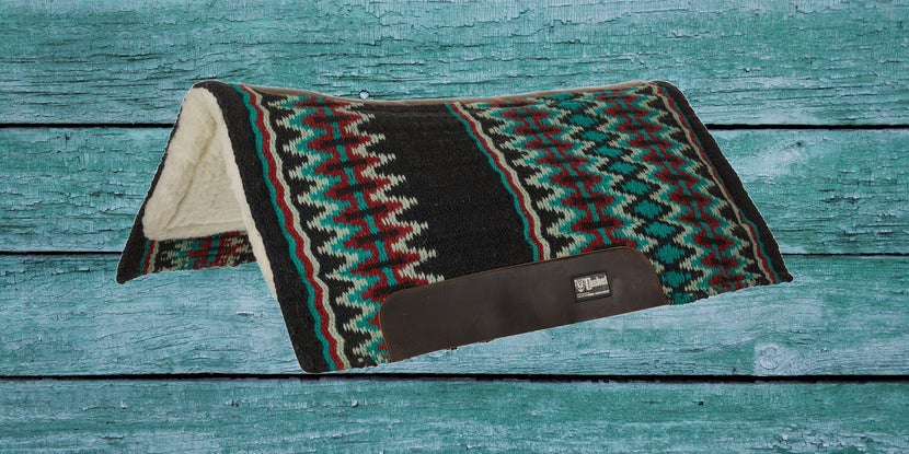 Cashel Blanket Top Performance Western Saddle Pad on a teal wood background