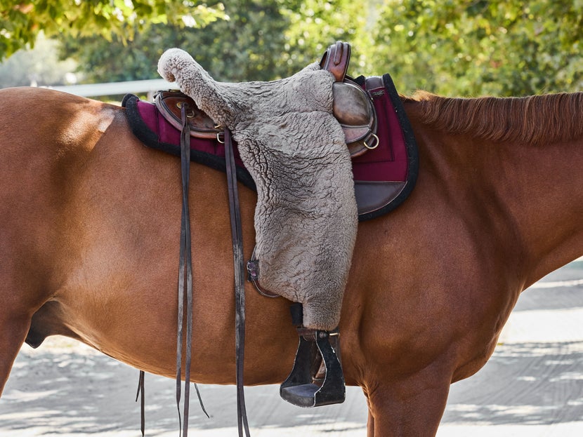 Bay horse wearing the Diamond Wool Endurance Round Saddle Pad w/ Shims saddle pad.
