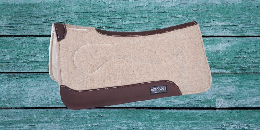Reinsman Nitro Gel Orthopedic Pad on teal wood background