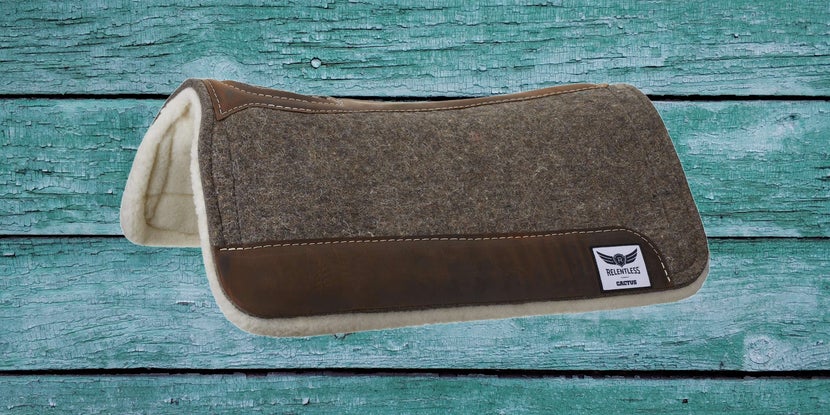 Relentless by Cactus Extreme Gel Western Saddle Pad on a teal wood background