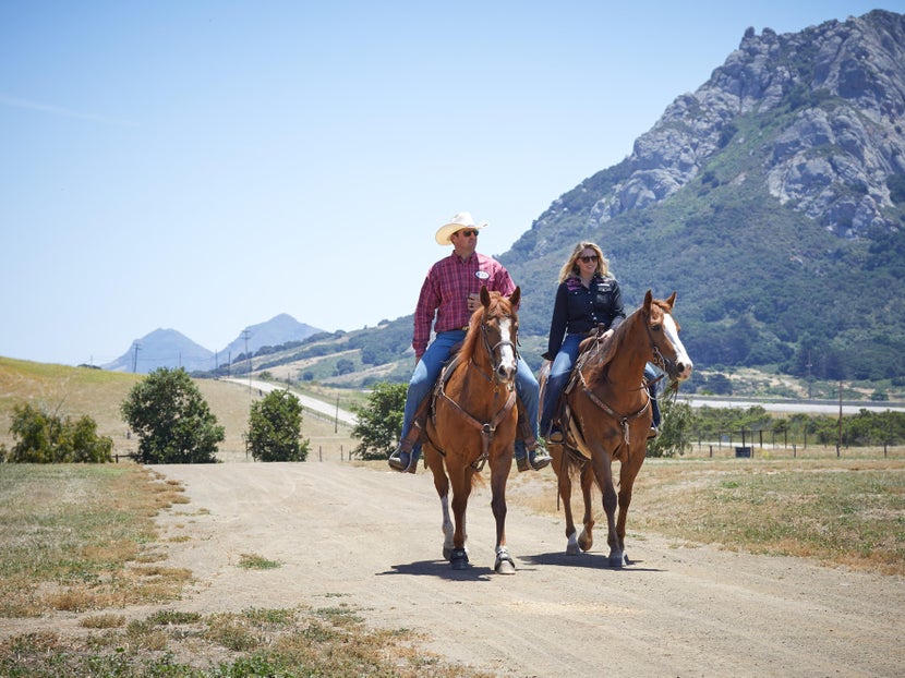 Girl and guy wearing Bex sunglasses, riding side by side. 