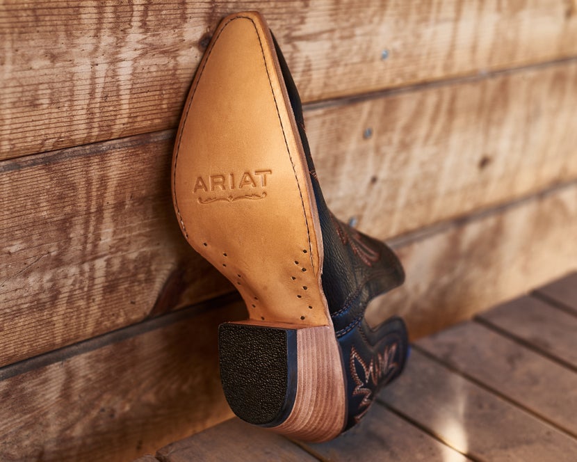 An Ariat boot with a leather outsole.