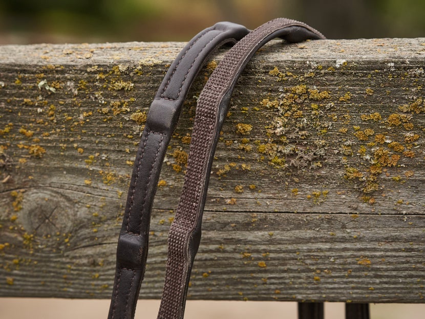 Leather & Rubber Hybrid (Combination) Reins sitting on a fence