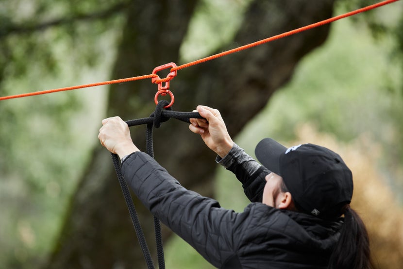 Gillian securing her horse's lead rope on the tie ring of the no-knot swivel. 