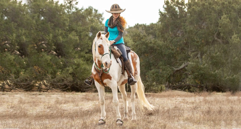 Trail rider wearing DaBrim visor on her Troxel helmet