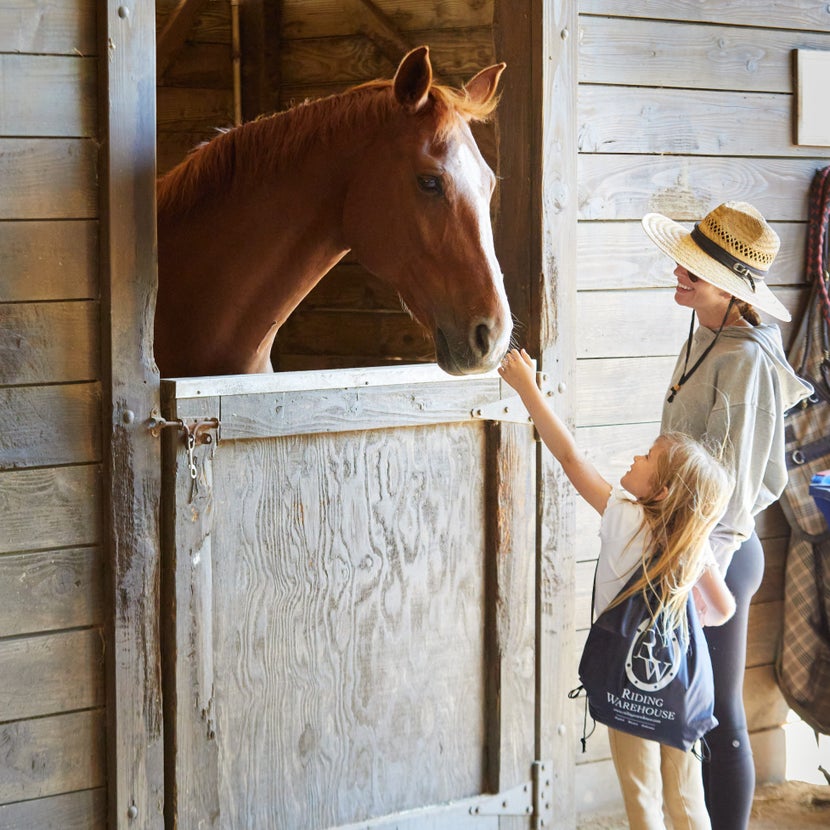 Mom dropping her child off at a summer horse camp