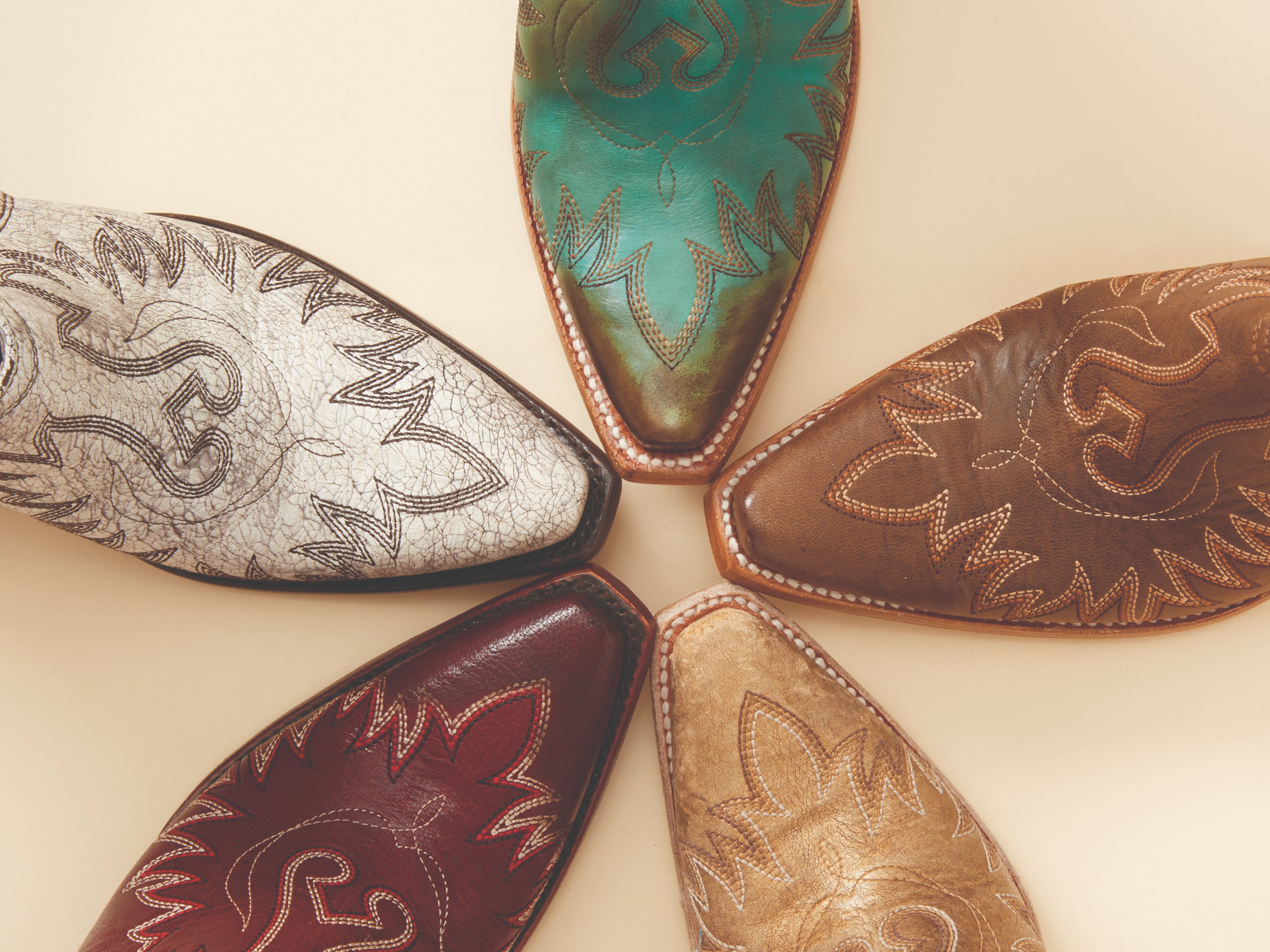 Snip-Toe cowboy boots in a circle, showing a variety of colors.