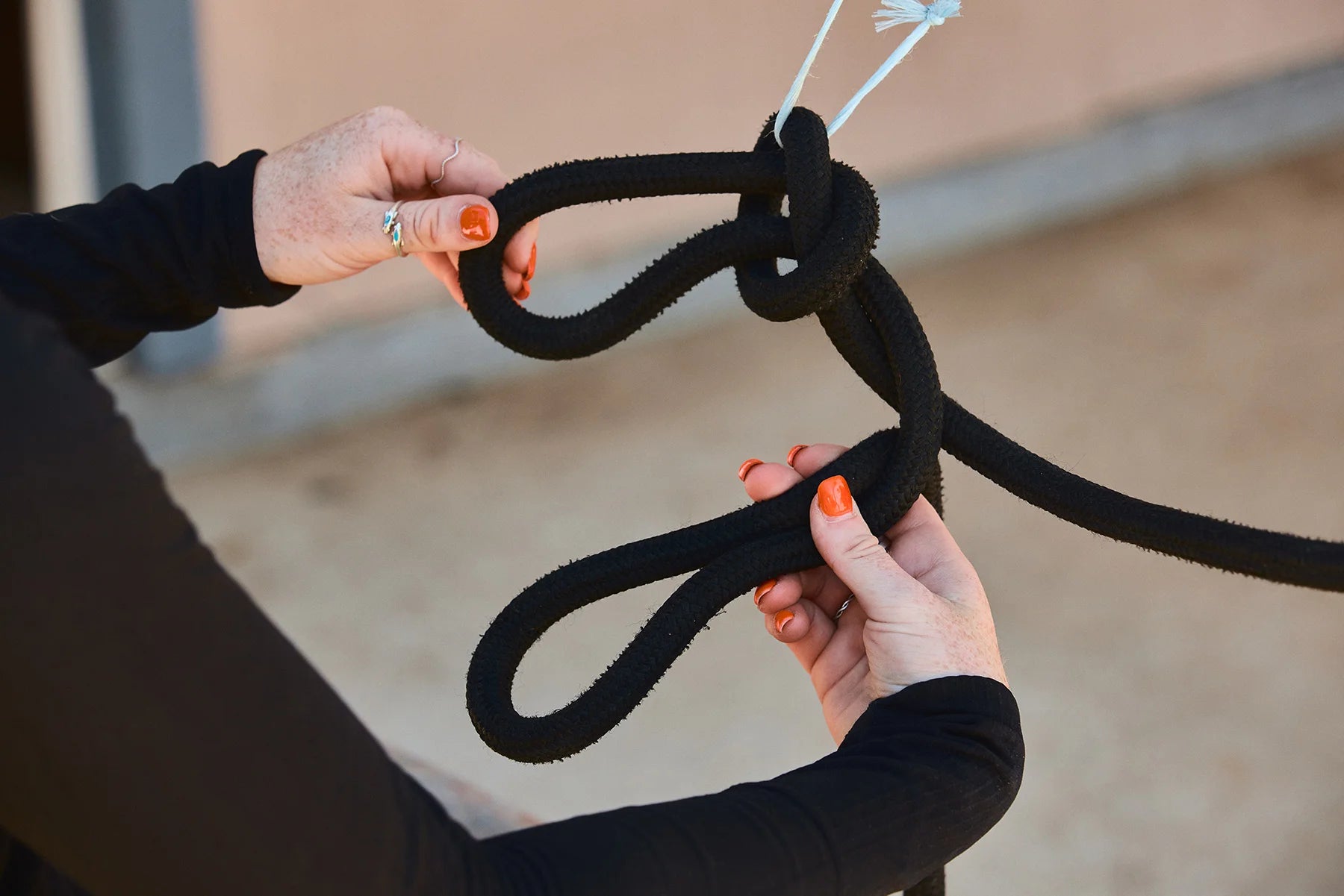 Now with the initial knot formed, we can safely secure the excess rope by using a daisy chain.