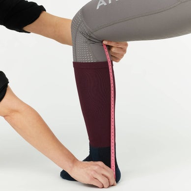 An example of how to measure a persons leg height for tall boots.