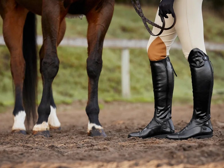 A horseback rider wearing knee patch breeches.
