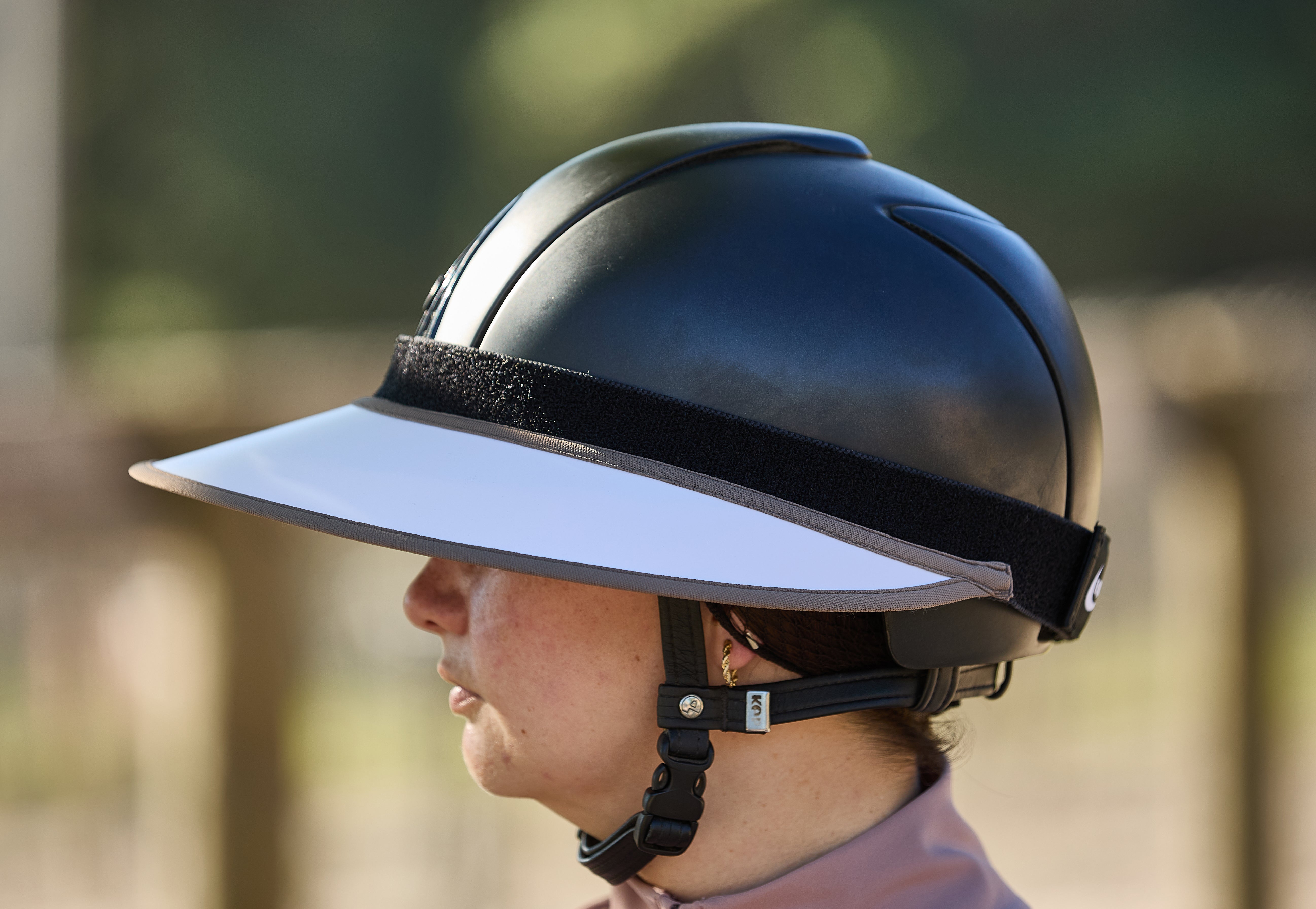 A horseback rider wearing the EquiVisor Sport Shorty offering Face-Only Coverage
