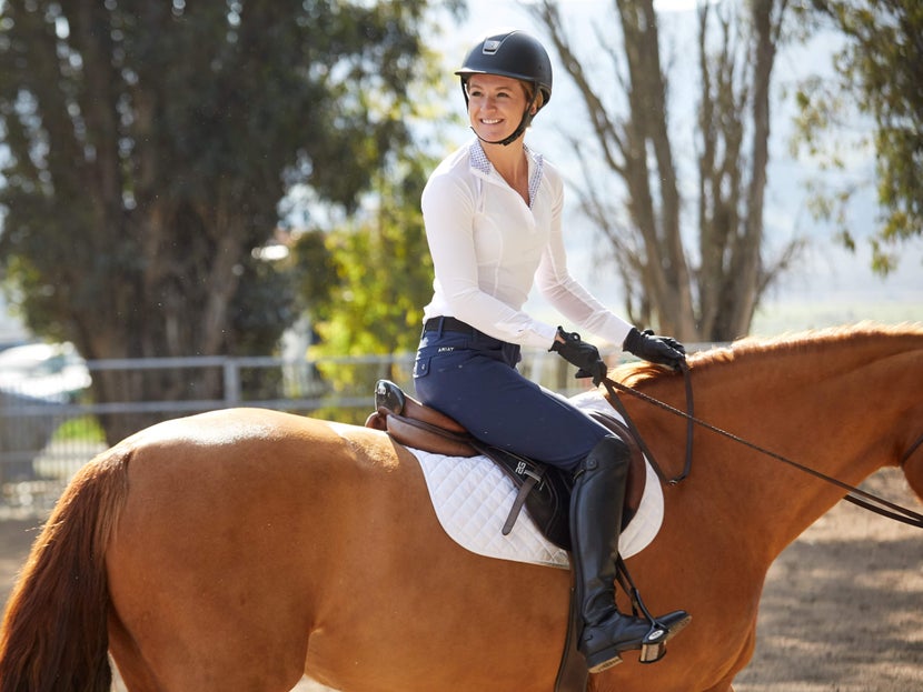 Woman on her horse wearing a Samshield Shadowmatt Riding Helmet.