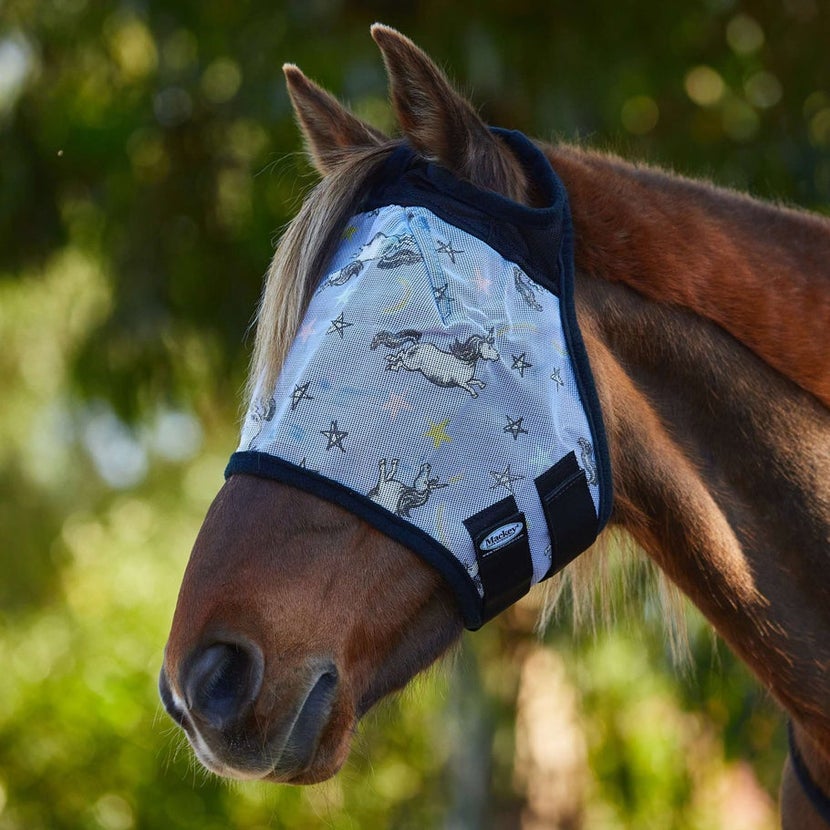 The Mackey Printed Fly Mask on a chestnut horse against a tree background. 