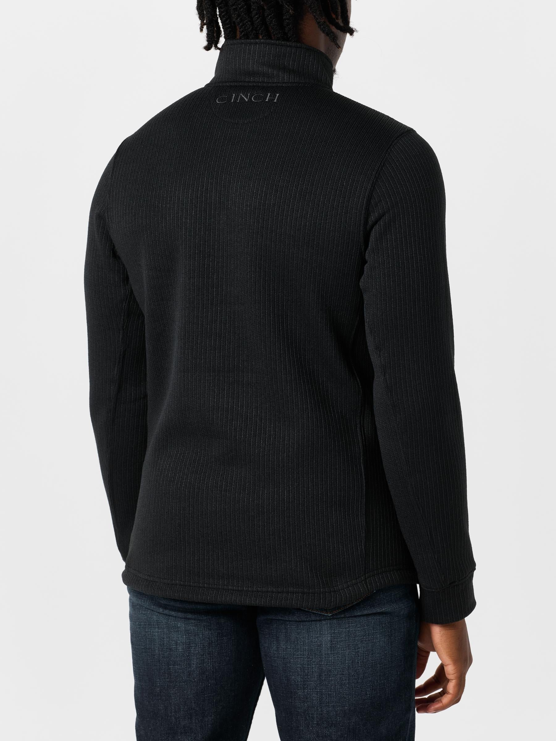 Back view of a man wearing the Cinch Men's 1/4 Zip Fleece Sweater Pullover.