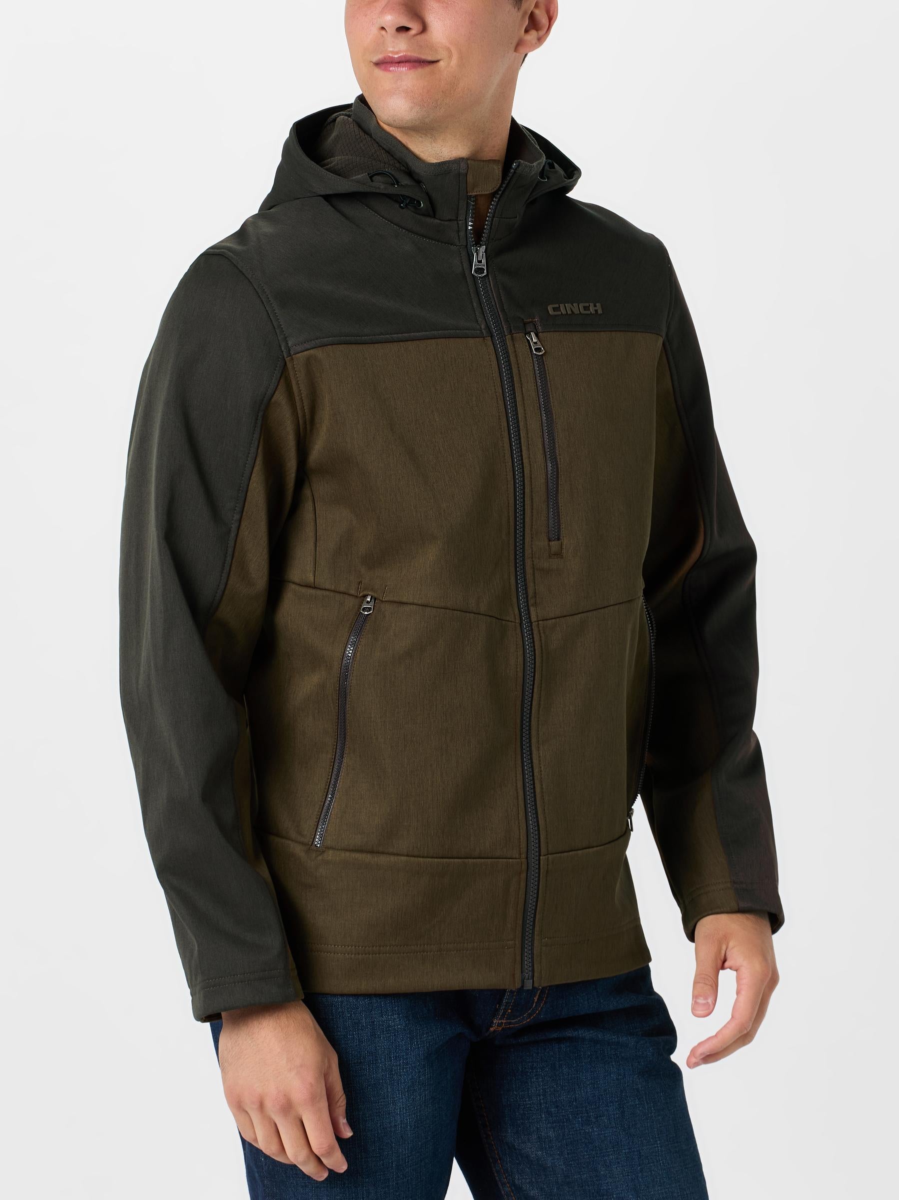 Front view of a man wearing the Cinch Men's Color Blocked Hooded Softshell Jacket.
